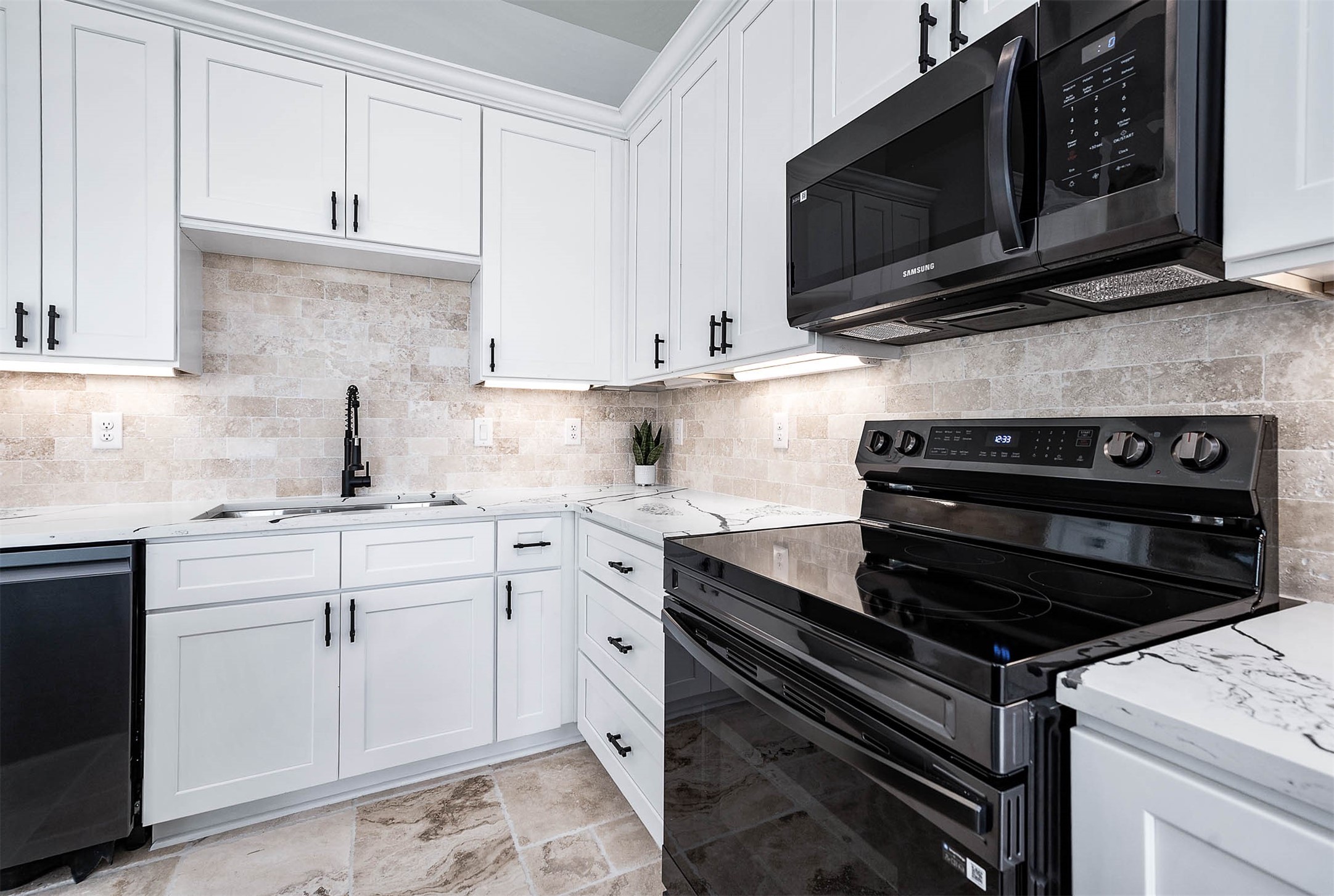 8903 Milby Street Needville, TX 77461 - Photo 14 of 32 a kitchen with cabinets stainless steel appliances and a counter space
