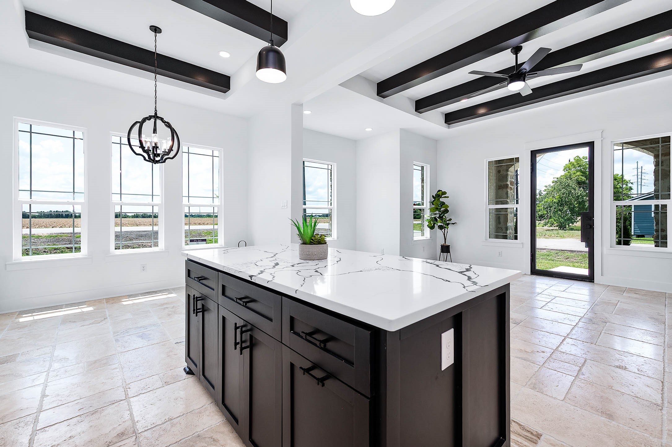 8903 Milby Street Needville, TX 77461 - Photo 15 of 32 a view of kitchen island with furniture and windows