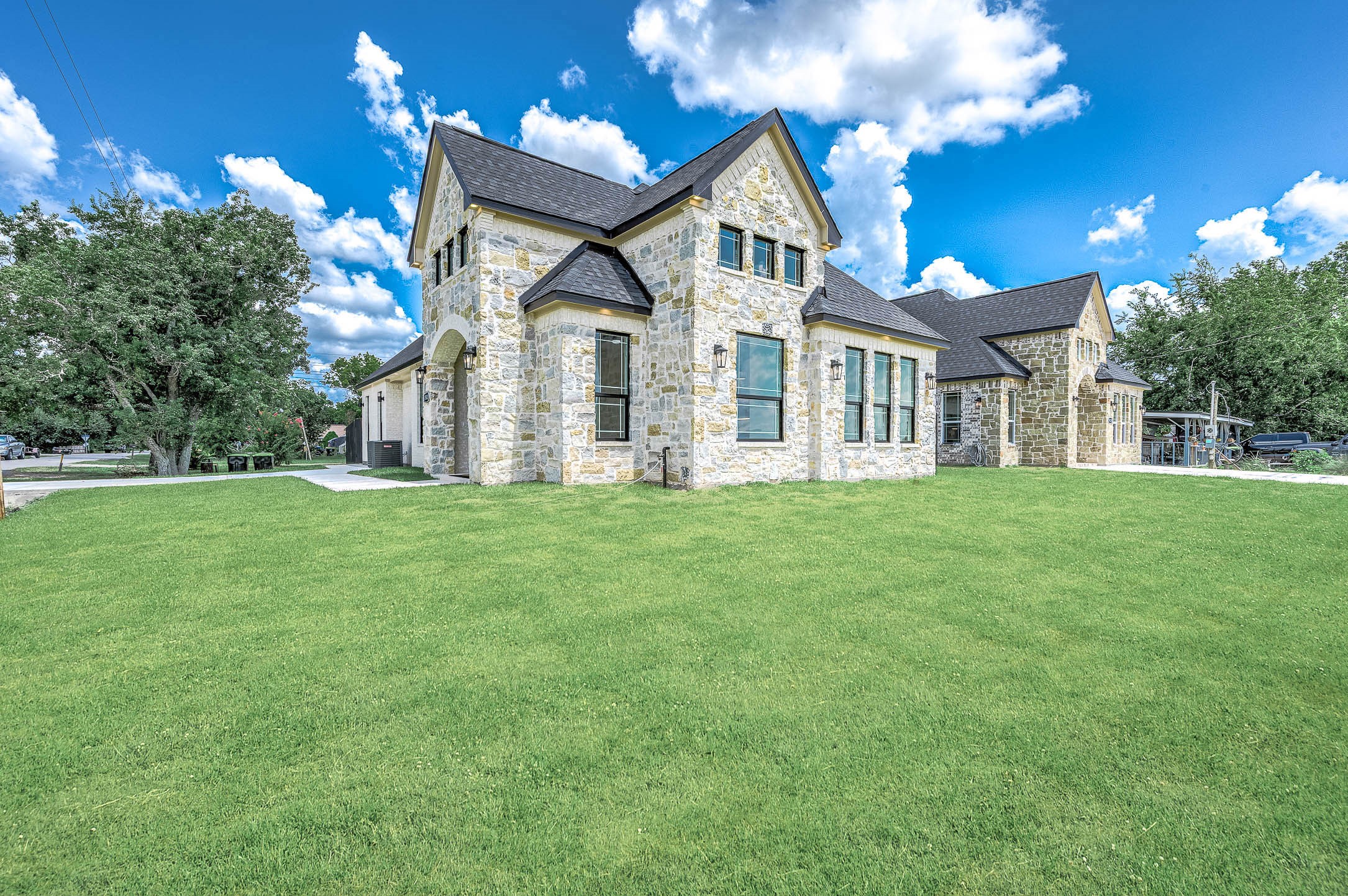 8903 Milby Street Needville, TX 77461 - Photo 2 of 32 a front view of a house with a yard