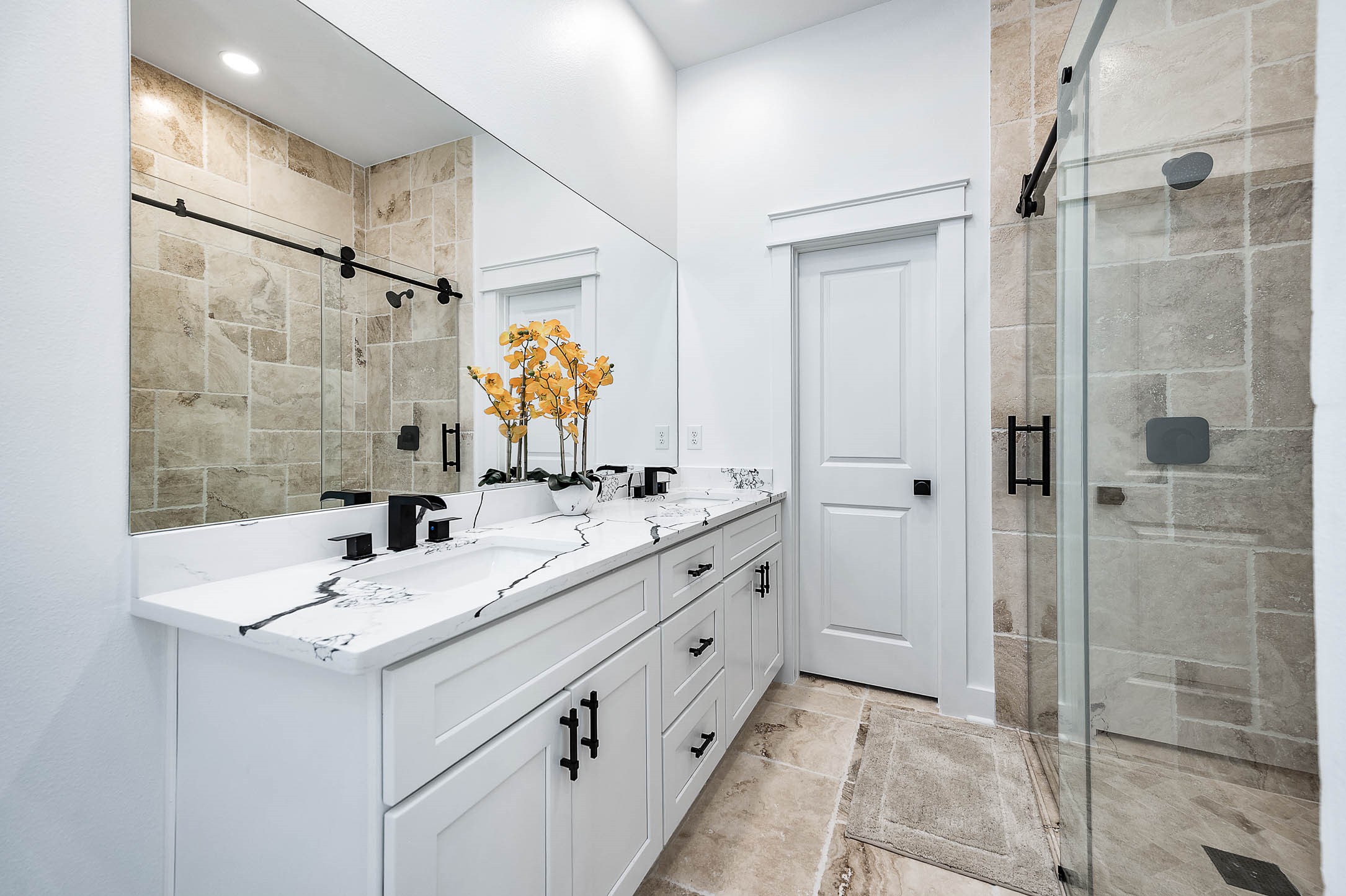 8903 Milby Street Needville, TX 77461 - Photo 23 of 32 a bathroom with a double vanity sink mirror and shower