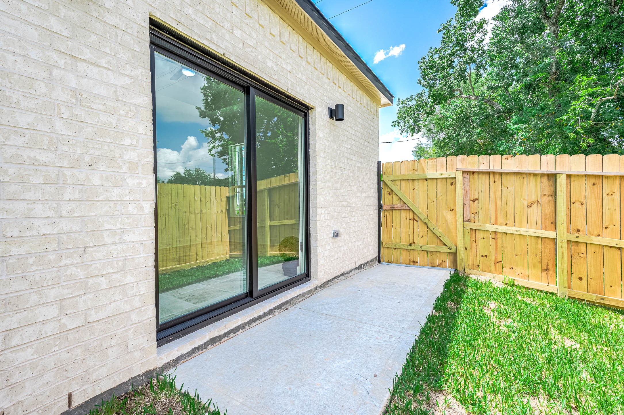 8903 Milby Street Needville, TX 77461 - Photo 30 of 32 a view of a backyard with a garden