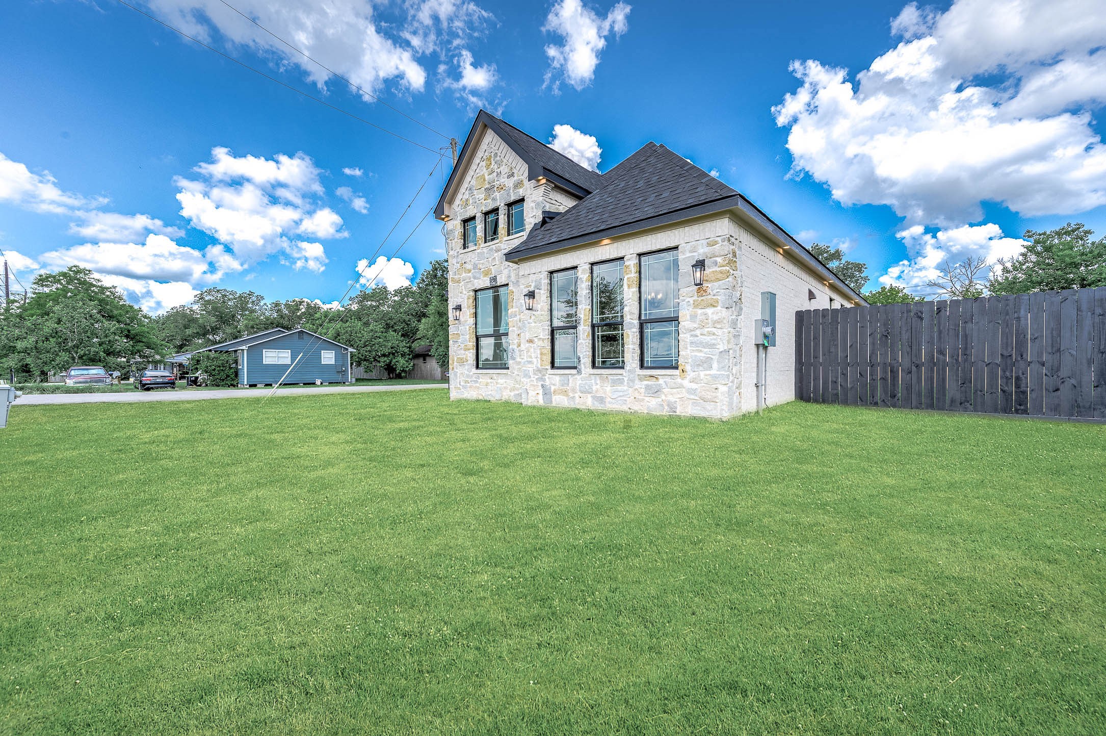 8903 Milby Street Needville, TX 77461 - Photo 3 of 32 a view of a house with a yard