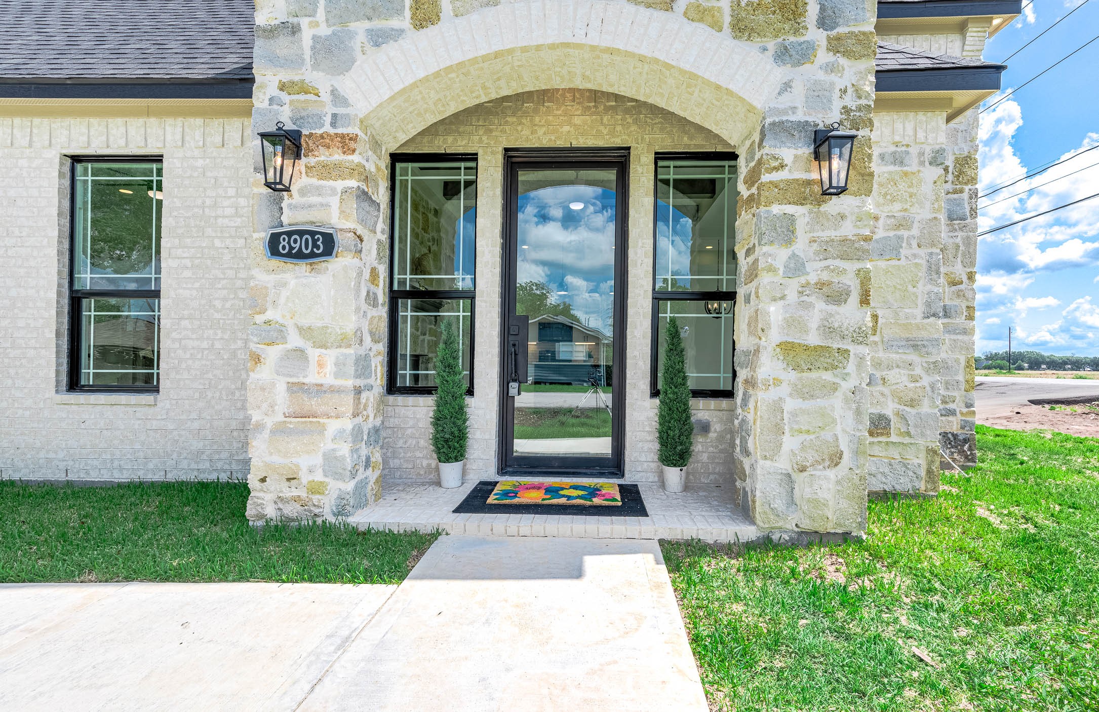 8903 Milby Street Needville, TX 77461 - Photo 6 of 32 a front view of a house with a yard