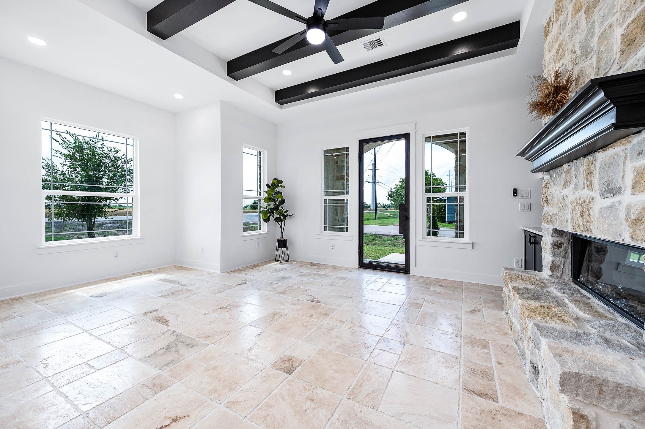 8903 Milby Street Needville, TX 77461 - Photo 9 of 32 a view of an empty room with window and fireplace