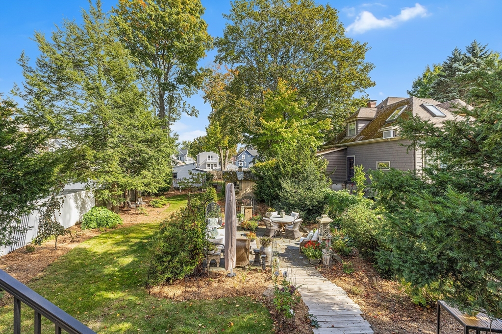 34 Cedar Street Wakefield, MA 01880 - Photo 24 of 33 a backyard of a house with a tree