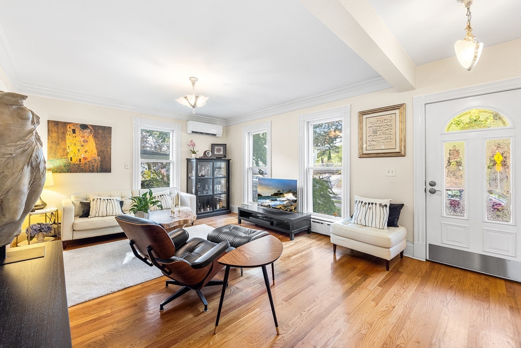 34 Cedar Street Wakefield, MA 01880 - Photo 4 of 33 a living room with fireplace furniture and a wooden floor