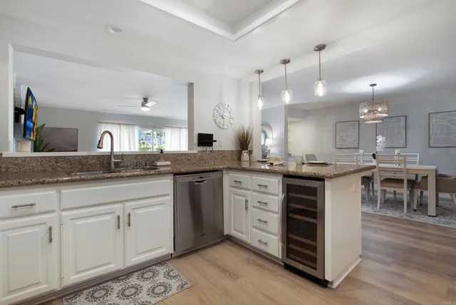 a kitchen with sink cabinets and stove
