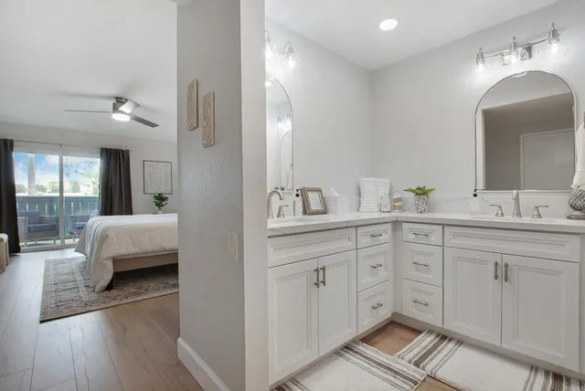 a en suite bathroom with double sink and a mirror