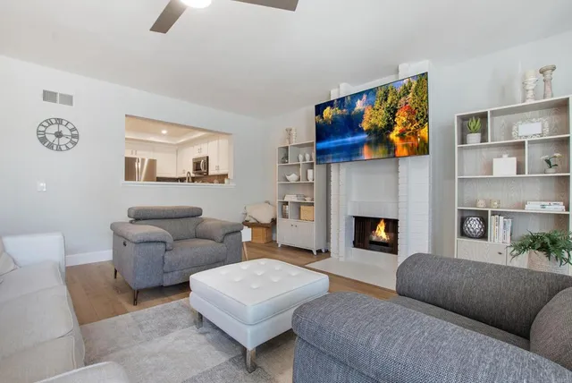 a living room with furniture and a fireplace