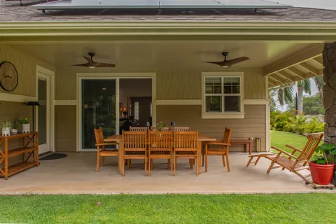 a view of a two chairs in a patio