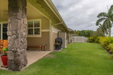 a view of a house with a backyard
