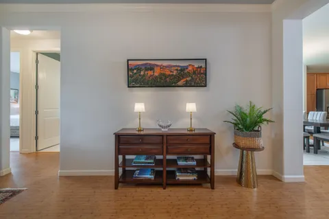 a view of a livingroom with furniture and a potted plant
