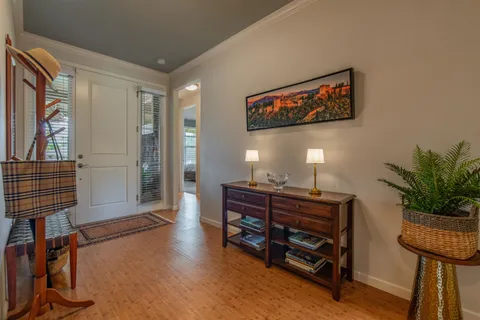 a view of a workspace with furniture and a potted plant
