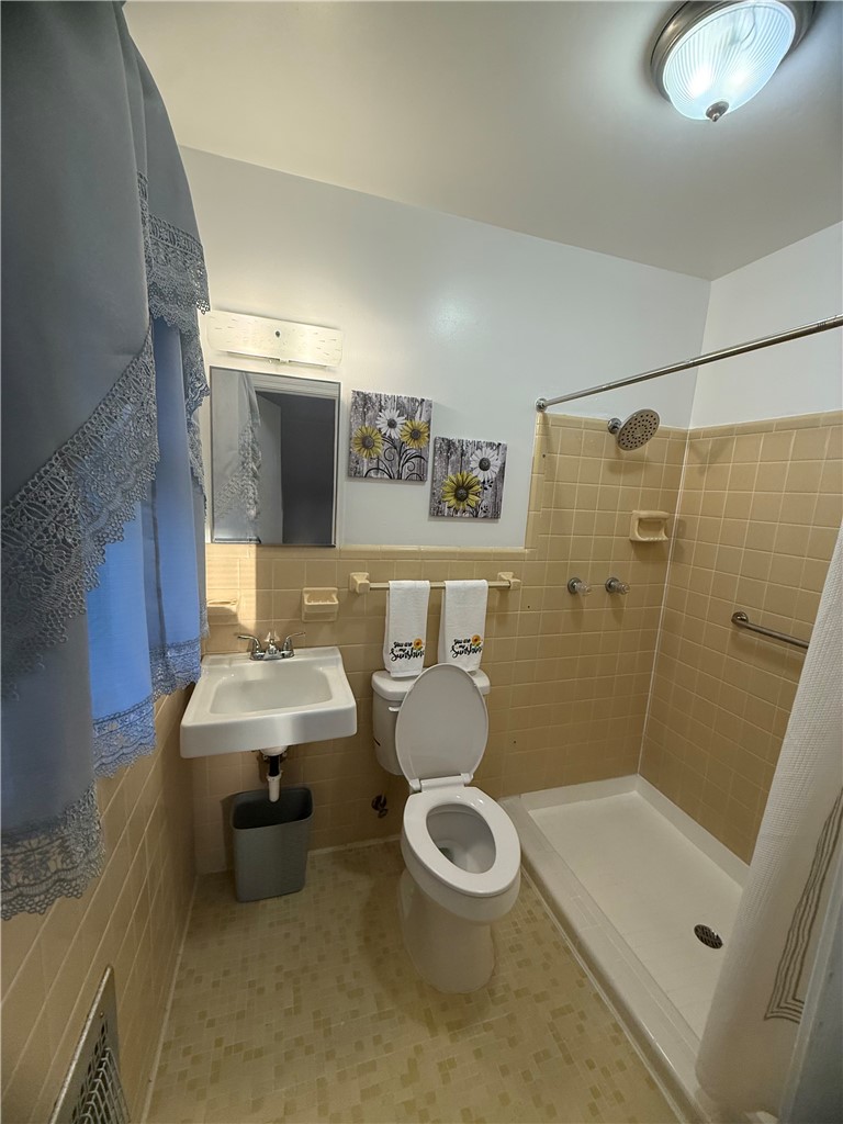 2008 Bolt Drive Anderson, SC 29621 - Photo 19 of 23 A functional bathroom setup includes classic wall tiling and a walk-in shower base.