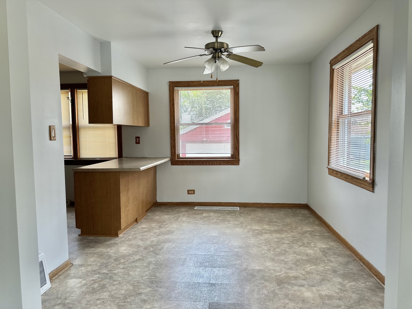 2509 5th Avenue North Riverside, IL 60546 - Photo 4 of 20 a view of an empty room with window and cabinet