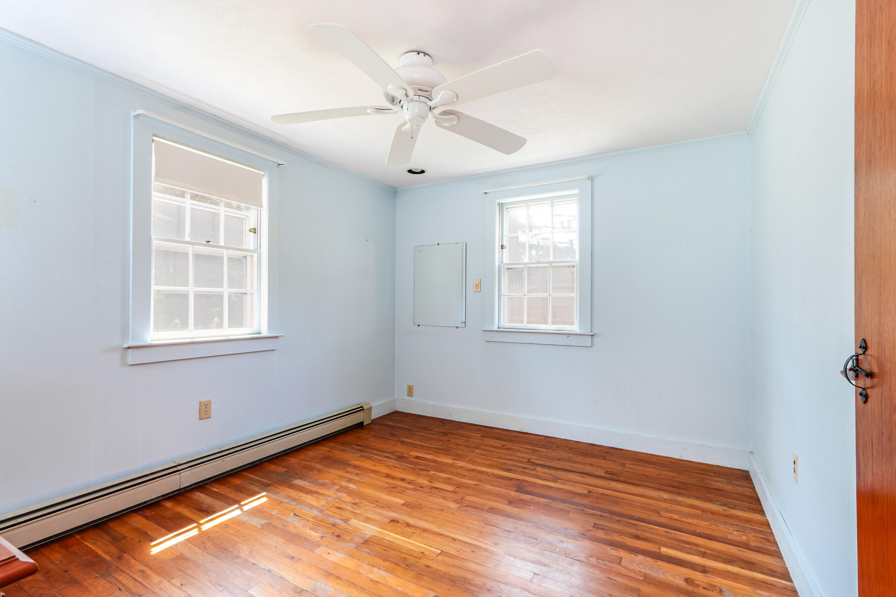 35 Susan Ruth Road Dennis Port, MA 02639 - Photo 11 of 23 wooden floor in an empty room with a window