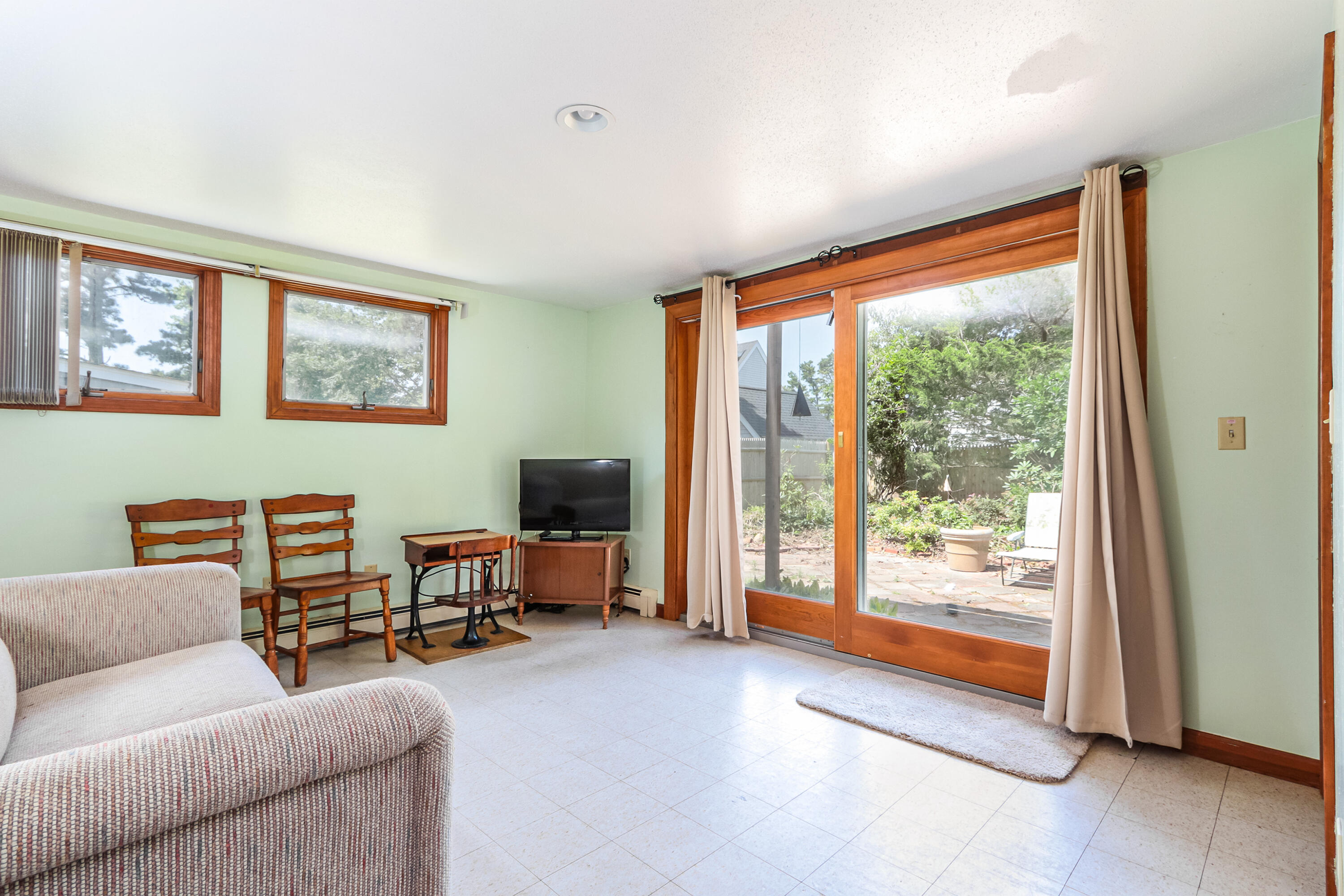 35 Susan Ruth Road Dennis Port, MA 02639 - Photo 15 of 23 a living room with furniture and a flat screen tv