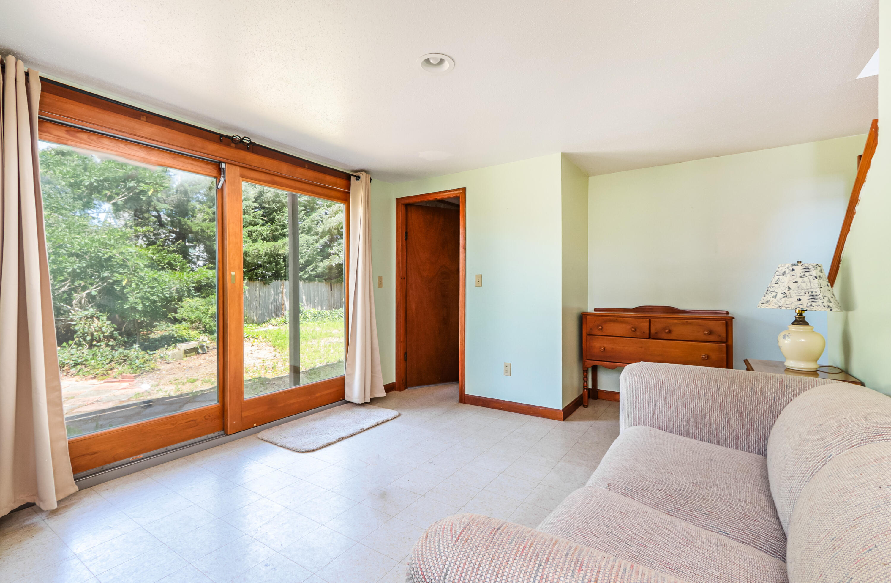 35 Susan Ruth Road Dennis Port, MA 02639 - Photo 16 of 23 a living room with furniture and a floor to ceiling window