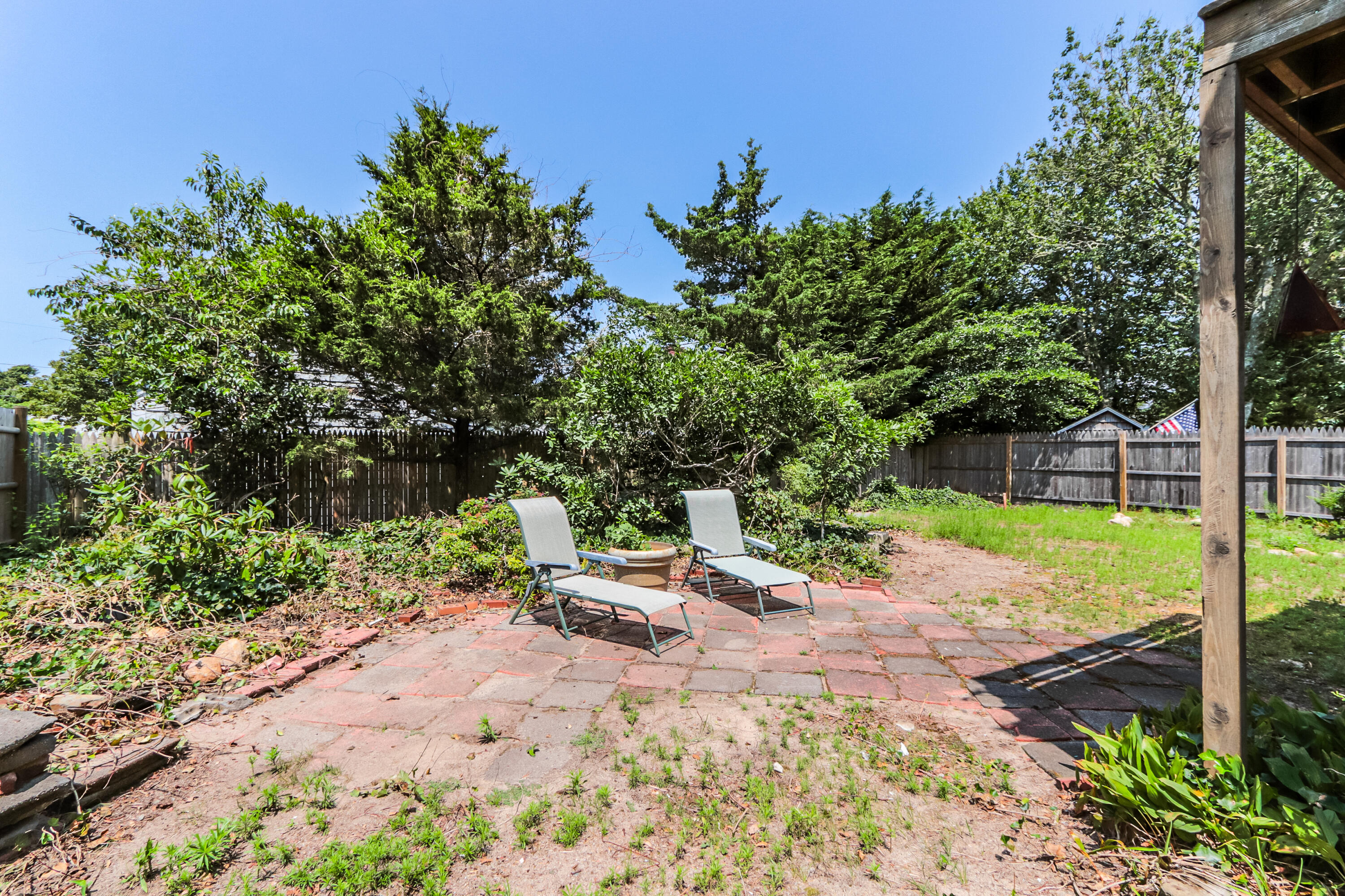 35 Susan Ruth Road Dennis Port, MA 02639 - Photo 21 of 23 a view of a chair with fire pit in front of a yard