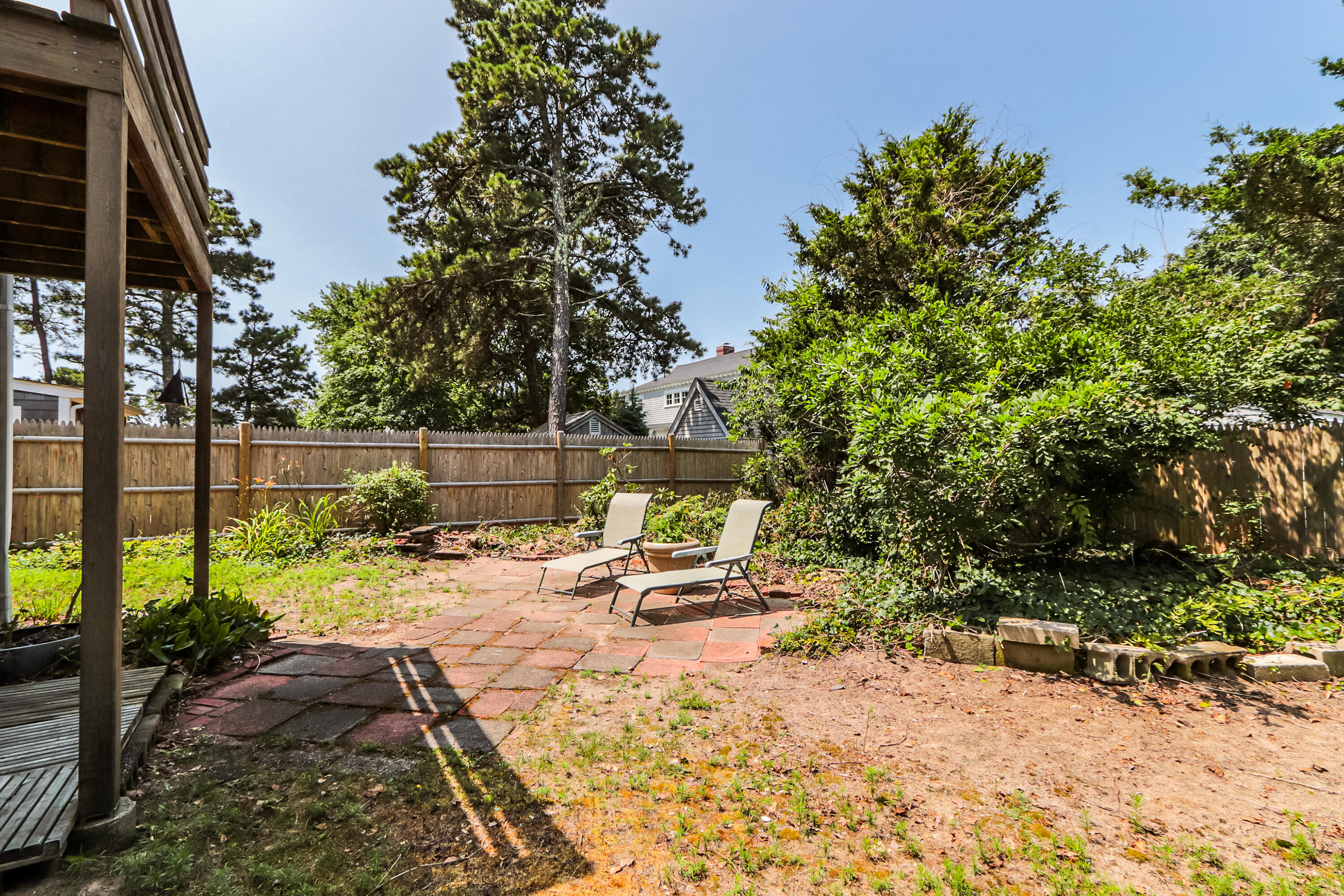 35 Susan Ruth Road Dennis Port, MA 02639 - Photo 22 of 23 a view of a backyard with plants and large trees