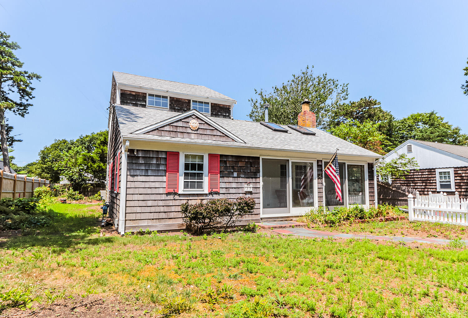 35 Susan Ruth Road Dennis Port, MA 02639 - Photo 3 of 23 front view of a house with a yard
