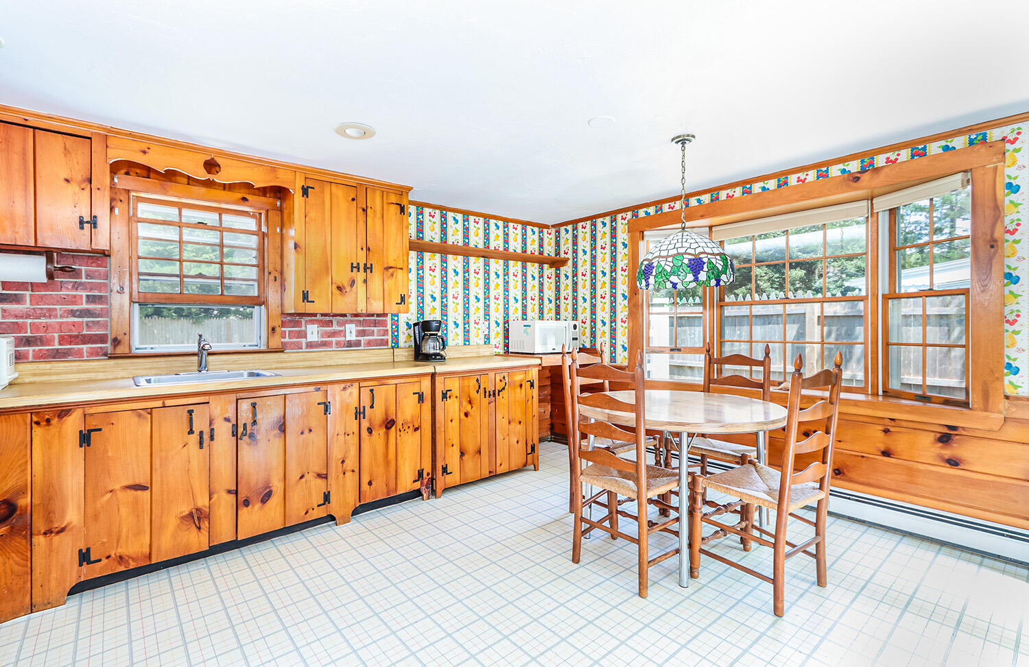 35 Susan Ruth Road Dennis Port, MA 02639 - Photo 7 of 23 a view of a large kitchen with dining table and a large window