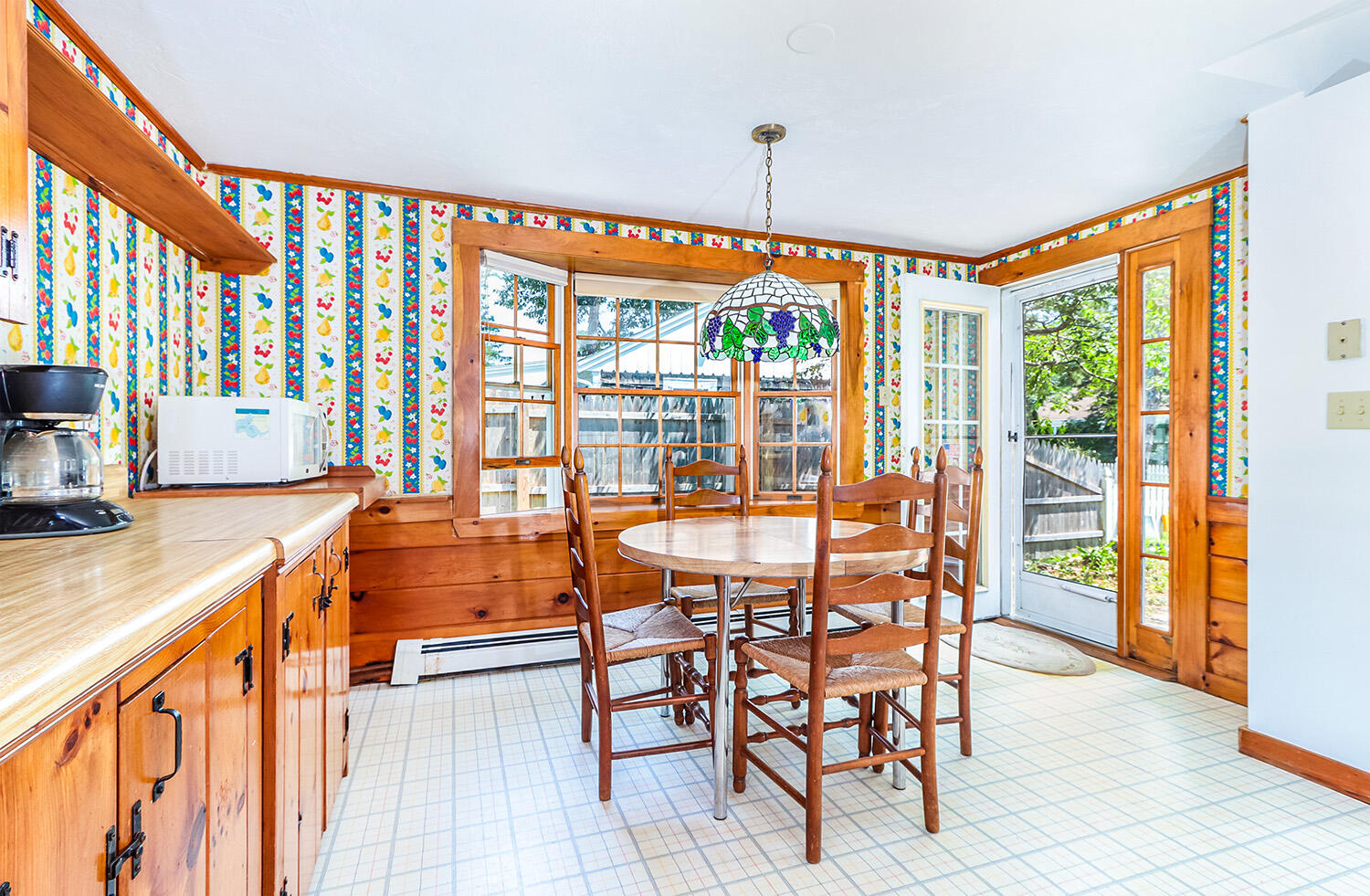 35 Susan Ruth Road Dennis Port, MA 02639 - Photo 9 of 23 a dining room with furniture and a floor to ceiling window