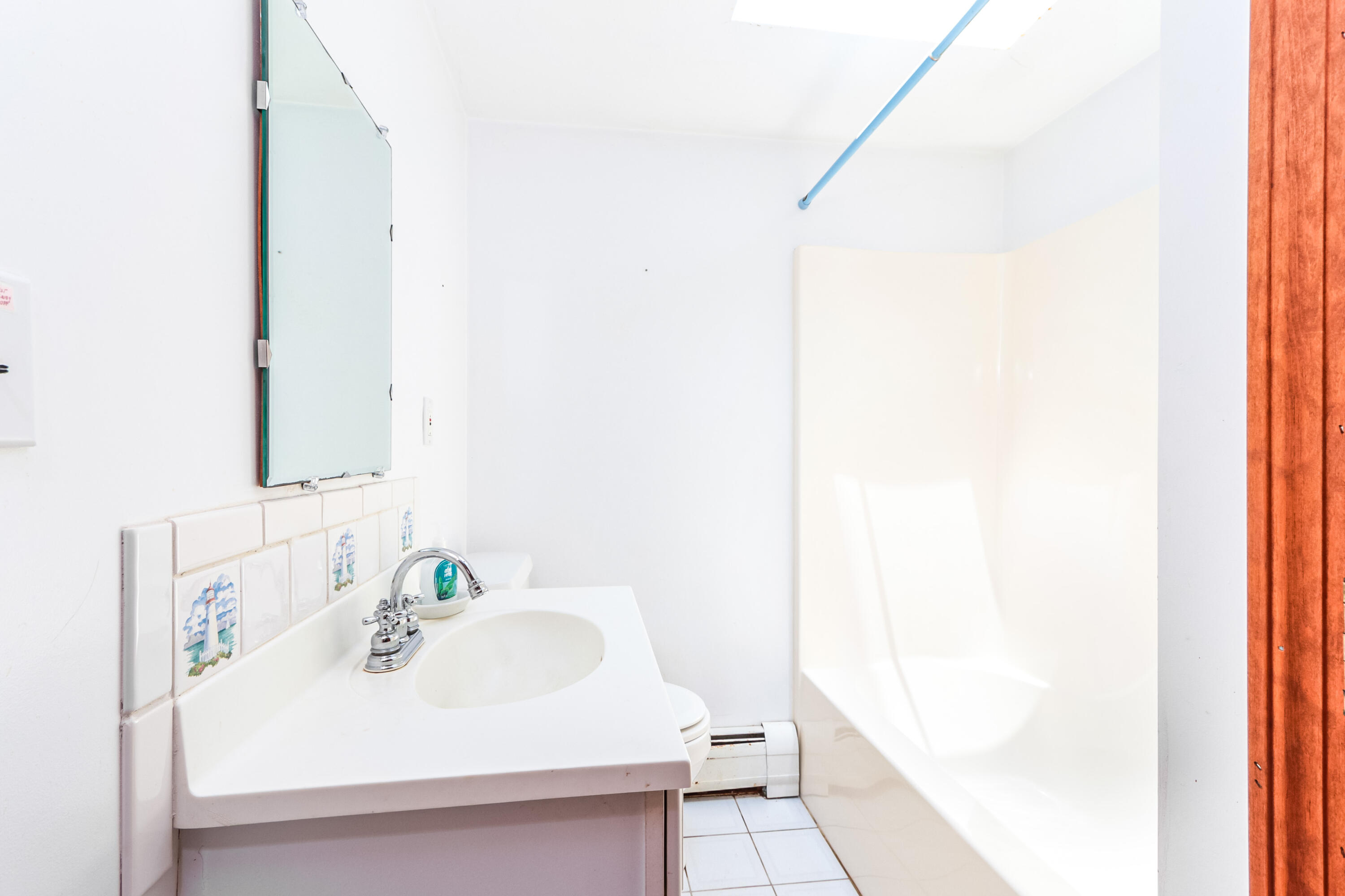 35 Susan Ruth Road Dennis Port, MA 02639 - Photo 10 of 23 a bathroom with a sink and a mirror