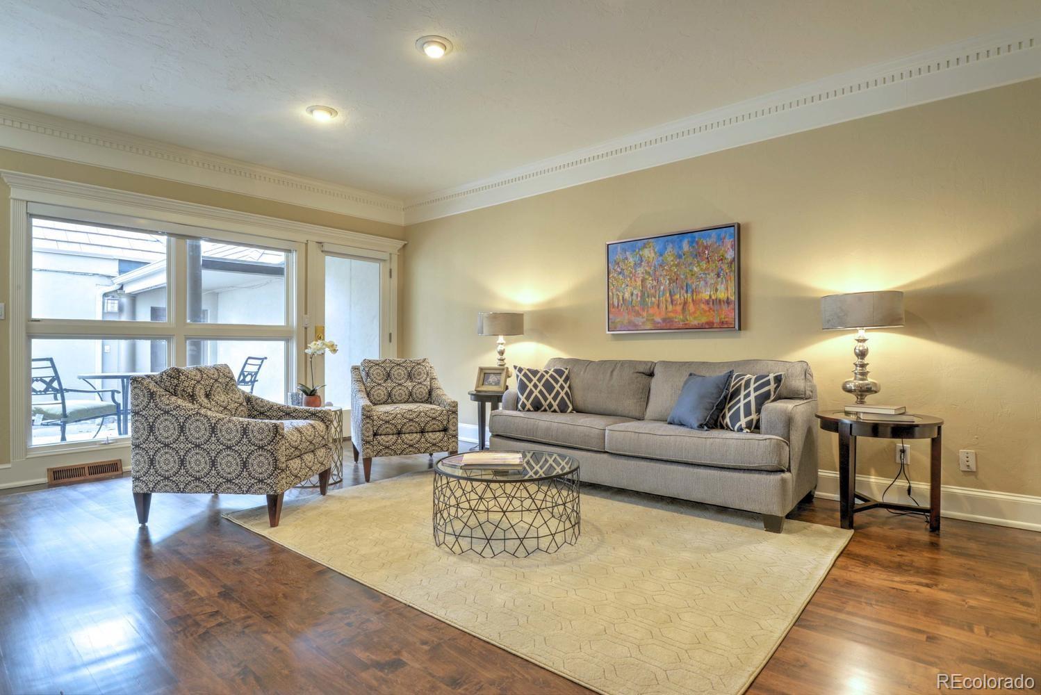 490 Columbine Street Denver, CO 80206 - Photo 12 of 33 a living room with furniture and a large window