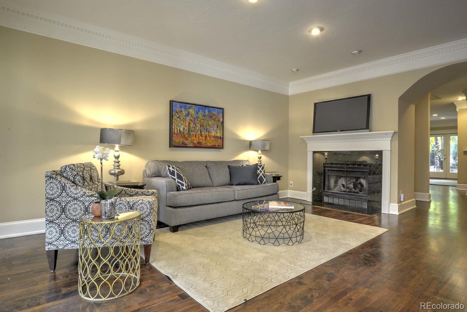 490 Columbine Street Denver, CO 80206 - Photo 13 of 33 a living room with furniture and a fireplace