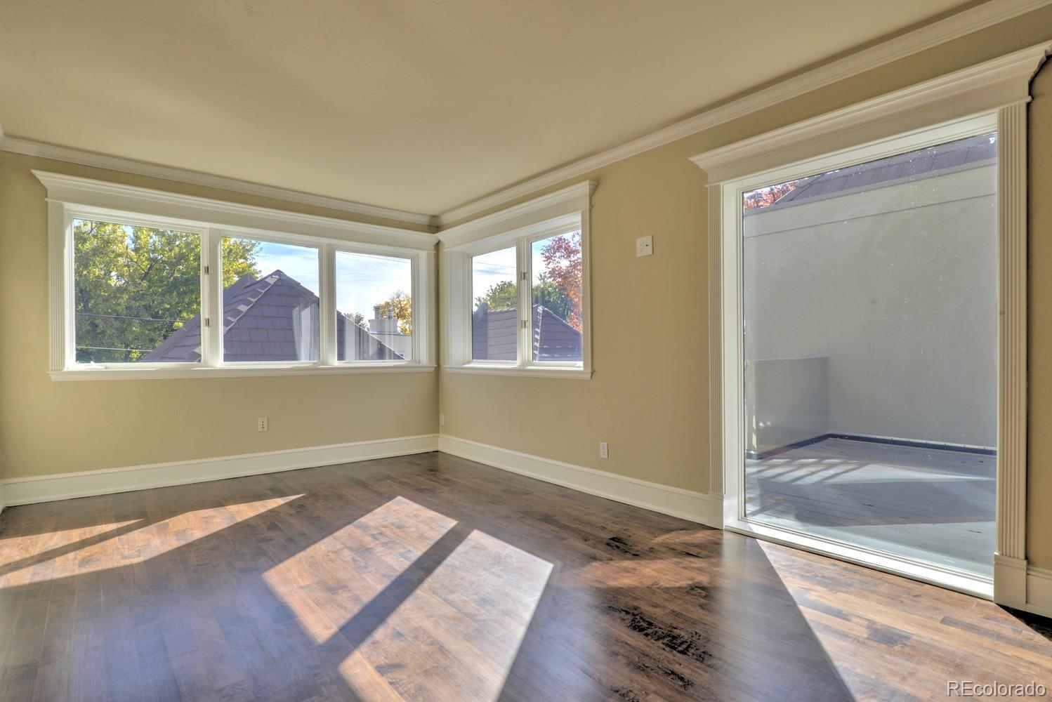 490 Columbine Street Denver, CO 80206 - Photo 23 of 33 a view of an empty room and window