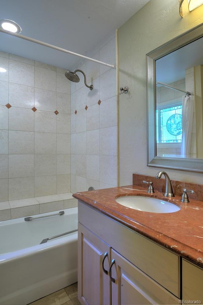 490 Columbine Street Denver, CO 80206 - Photo 29 of 33 a bathroom with a sink and a bathtub