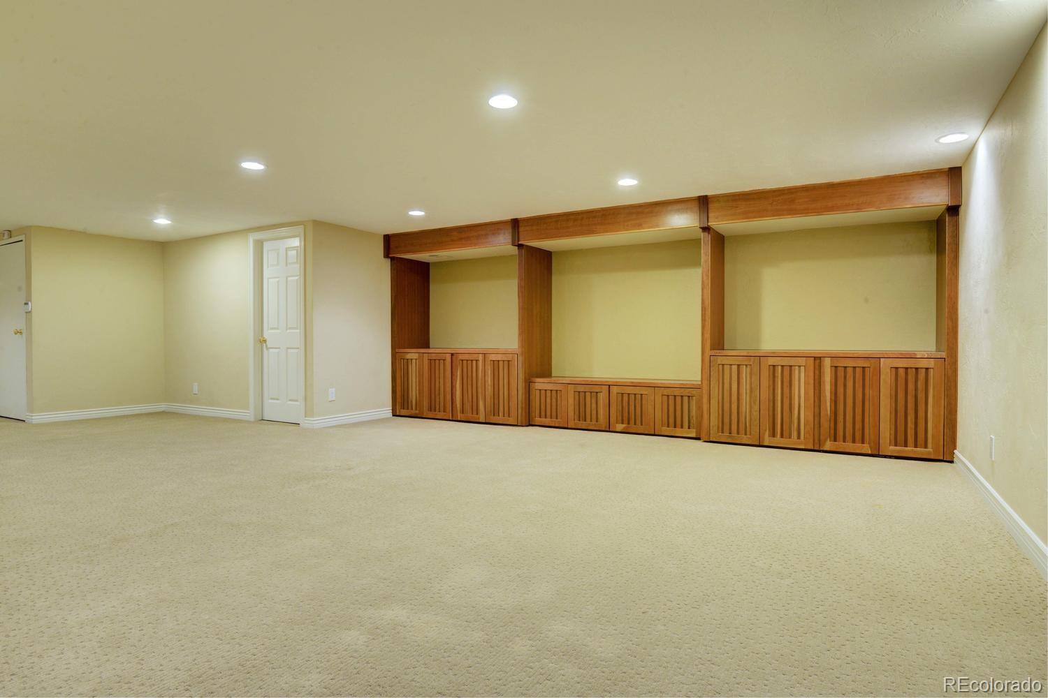 490 Columbine Street Denver, CO 80206 - Photo 30 of 33 an empty room with wooden floor and windows
