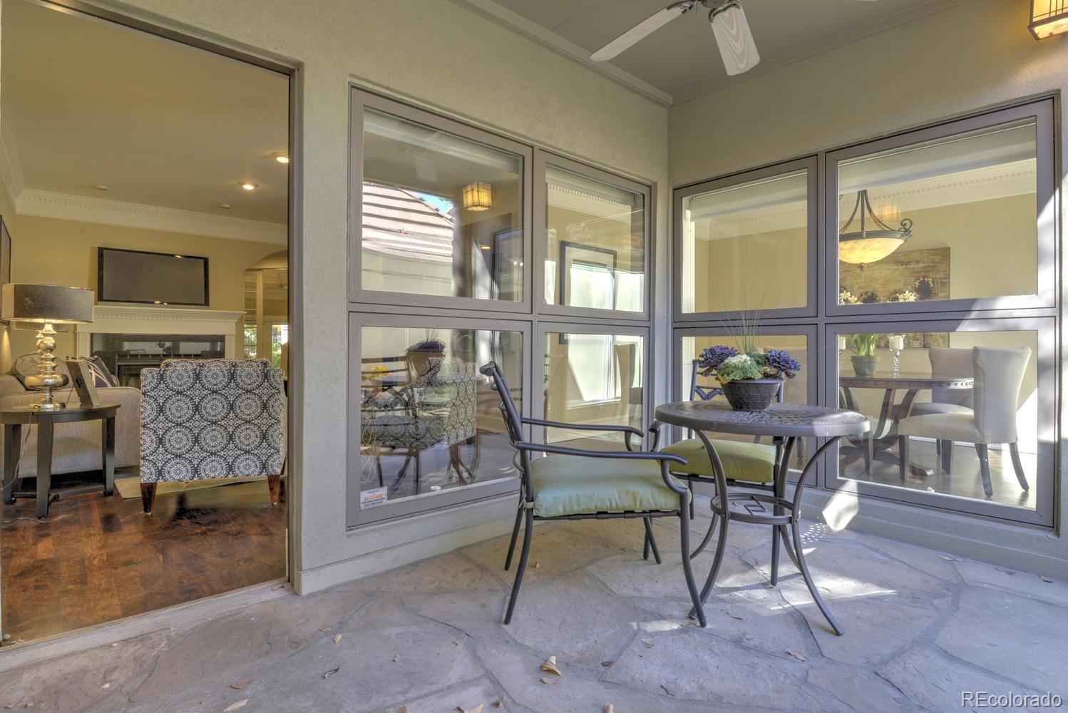 490 Columbine Street Denver, CO 80206 - Photo 32 of 33 a dining room with furniture and a floor to ceiling window