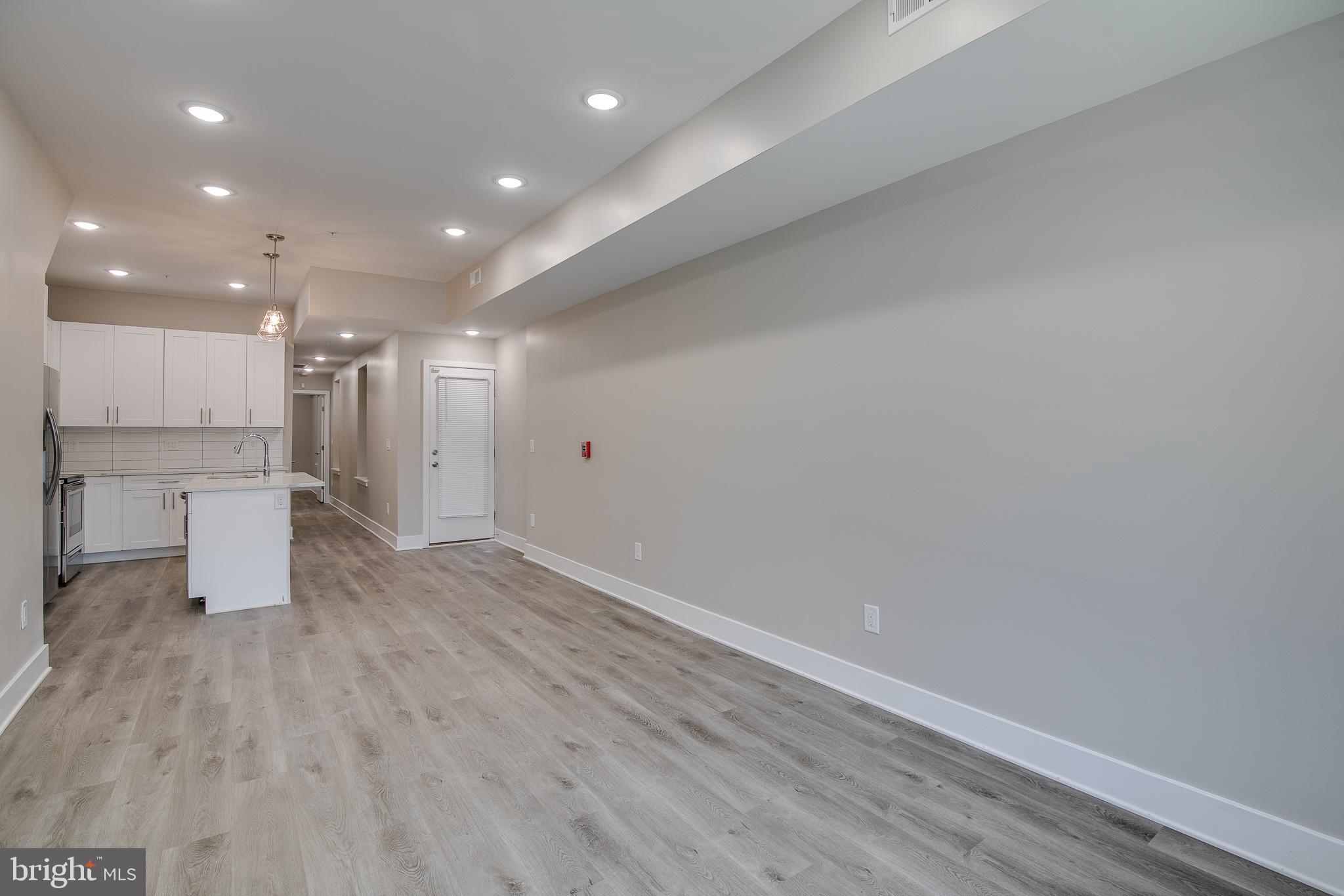 2017 North College Avenue, Unit 1 Philadelphia, PA 19121 - Photo 13 of 27 a view of a kitchen with a dishwasher and wooden floor