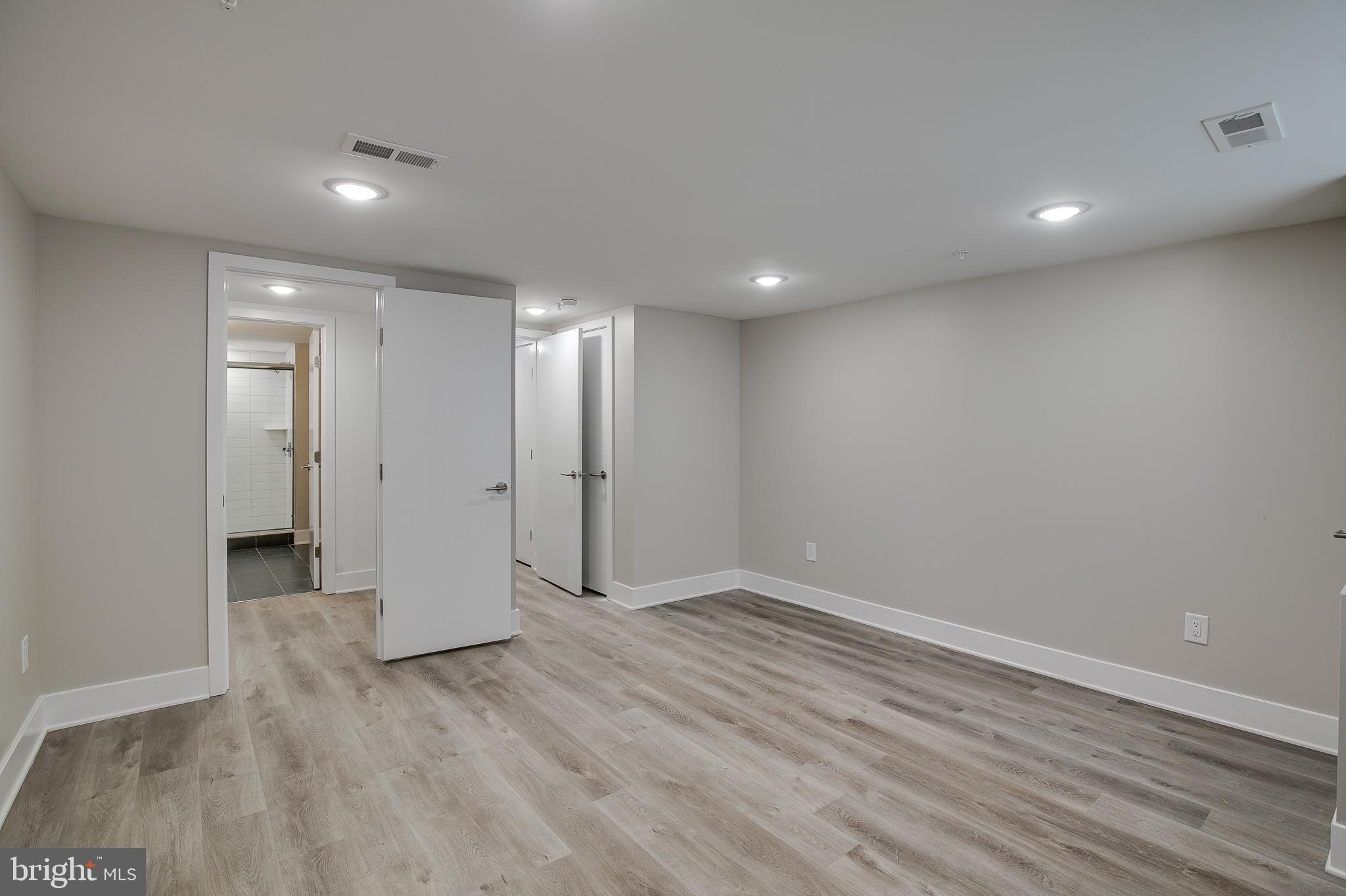 2017 North College Avenue, Unit 1 Philadelphia, PA 19121 - Photo 16 of 27 a view of an empty room with wooden floor