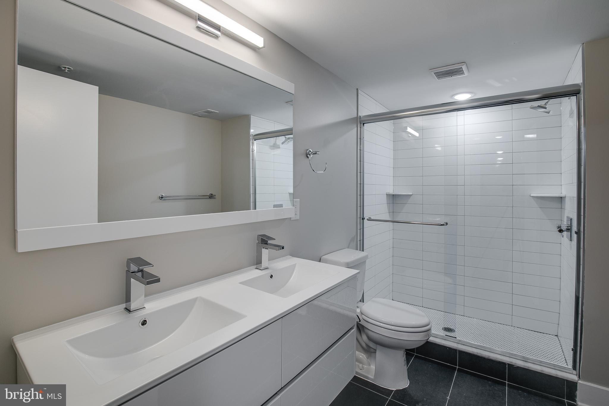 2017 North College Avenue, Unit 1 Philadelphia, PA 19121 - Photo 19 of 27 a bathroom with a sink toilet and shower
