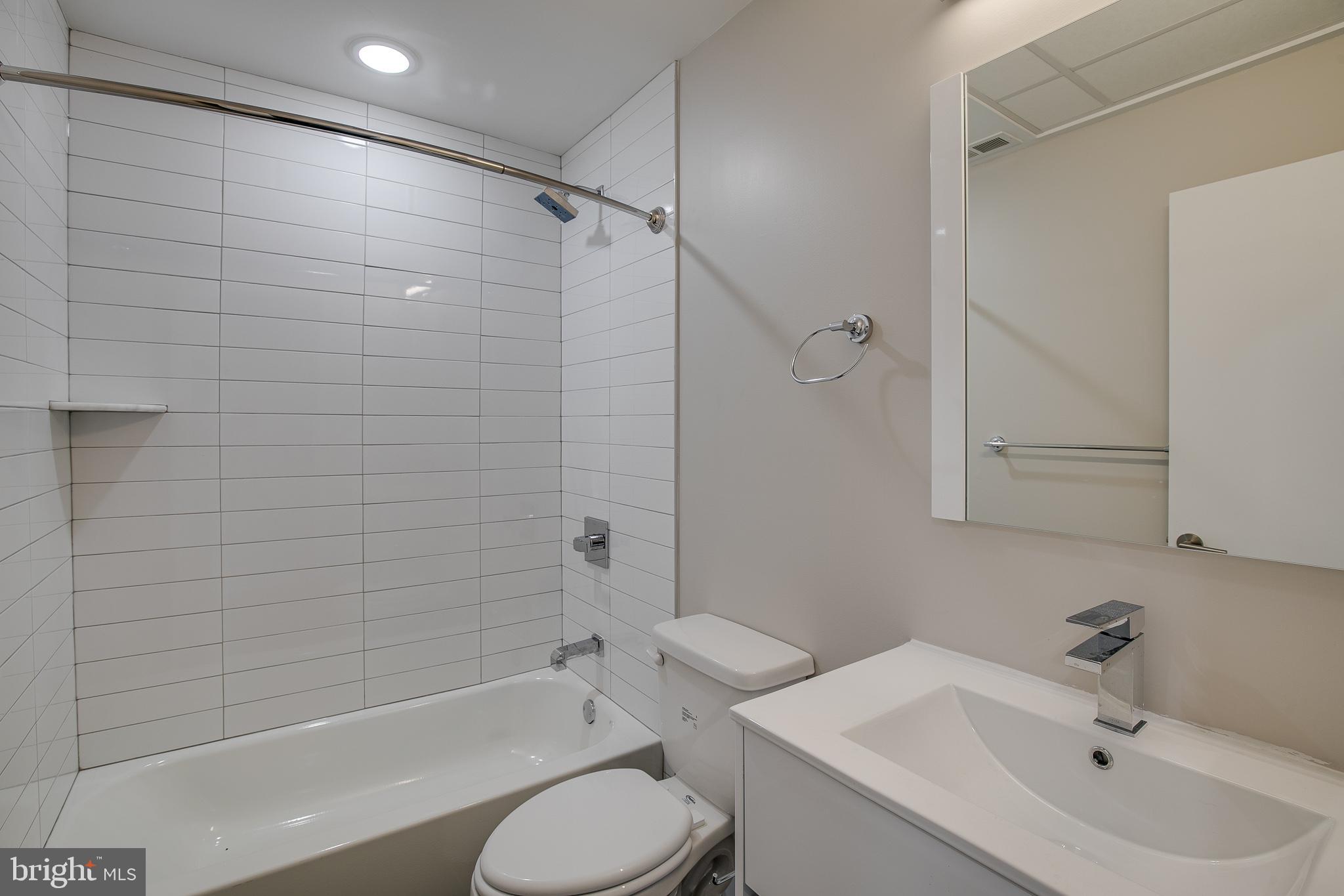 2017 North College Avenue, Unit 1 Philadelphia, PA 19121 - Photo 25 of 27 a bathroom with a sink toilet and shower
