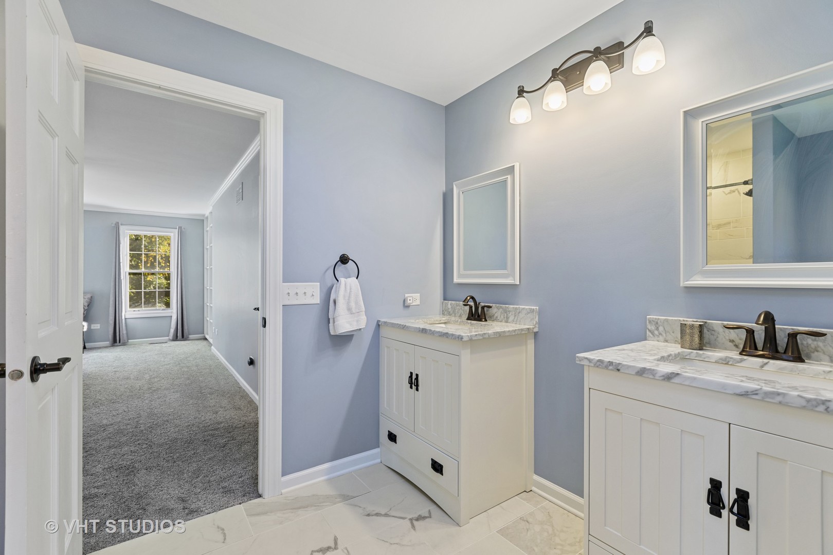 470 Long Hill Road Gurnee, IL 60031 - Photo 19 of 32 a bathroom with a sink and mirror with toilet