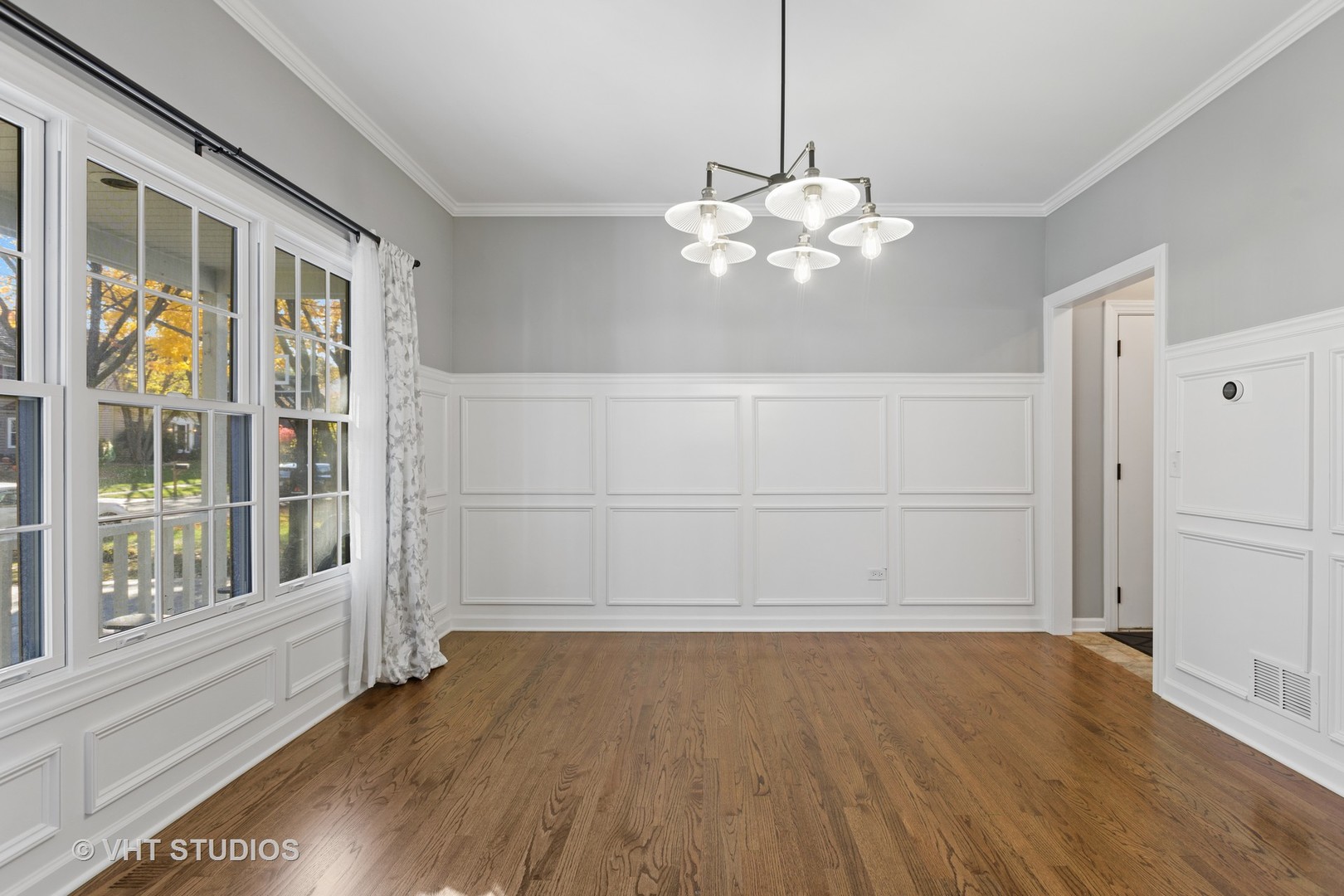 470 Long Hill Road Gurnee, IL 60031 - Photo 6 of 32 a view of an empty room with a window and wooden floor
