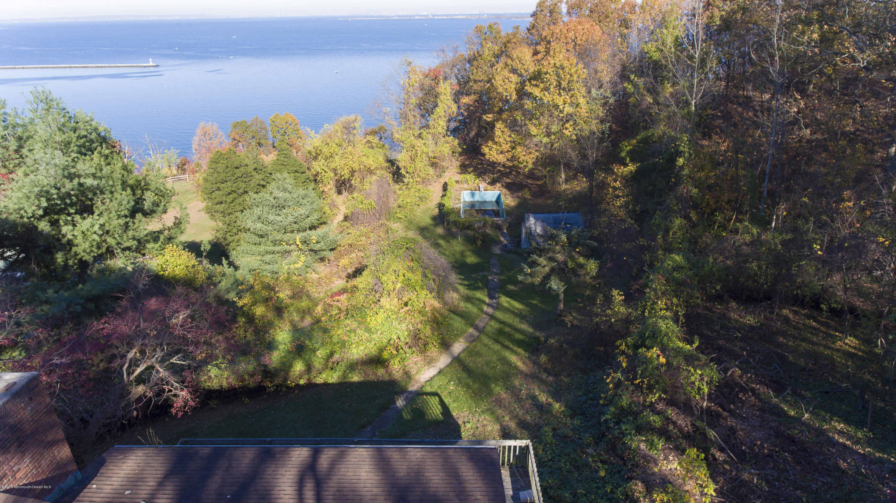 8 Belvidere Road Atlantic Highlands, NJ 07716 - Photo 7 of 8 a view of a lake with a building in the background