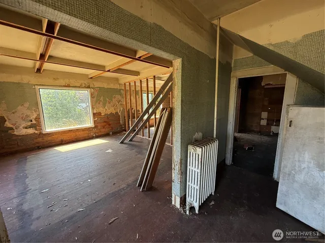 a view of an empty room with a window