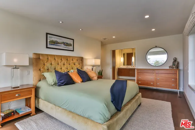 a kitchen with sink a window and cabinets