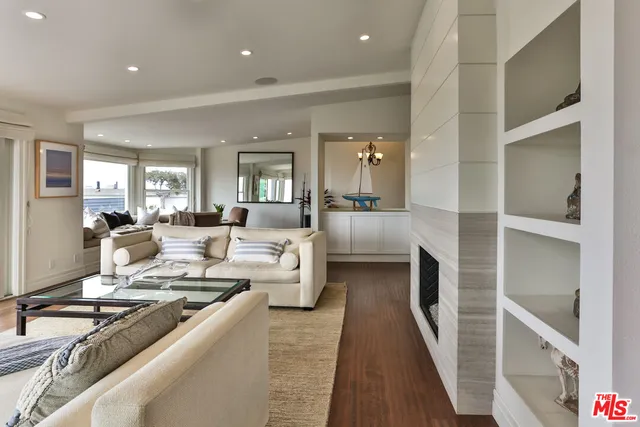 a view of a balcony with two chairs and a table