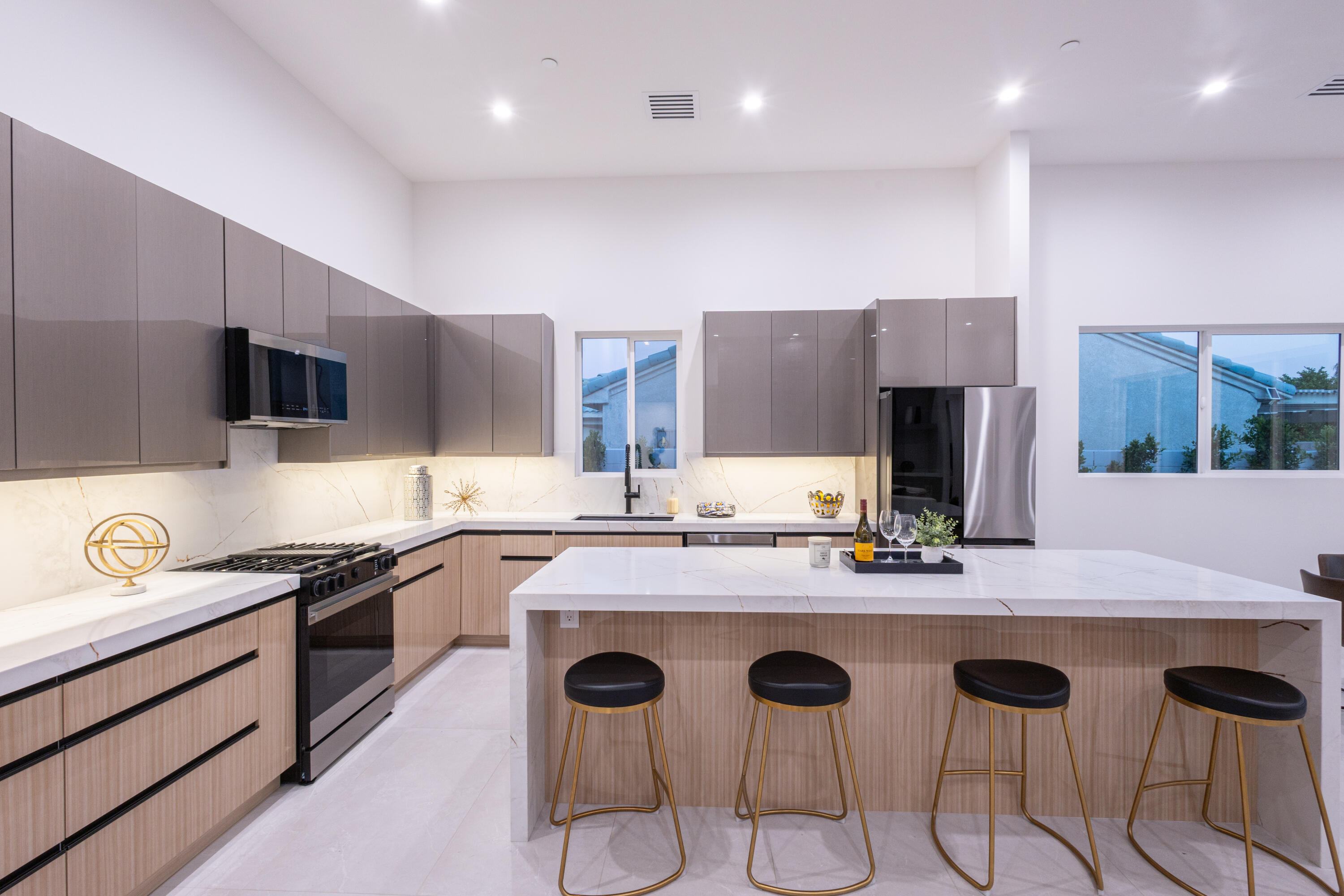 67385 Ovante Road Cathedral City, CA 92234 - Photo 11 of 32 a kitchen with stainless steel appliances granite countertop a sink and a stove