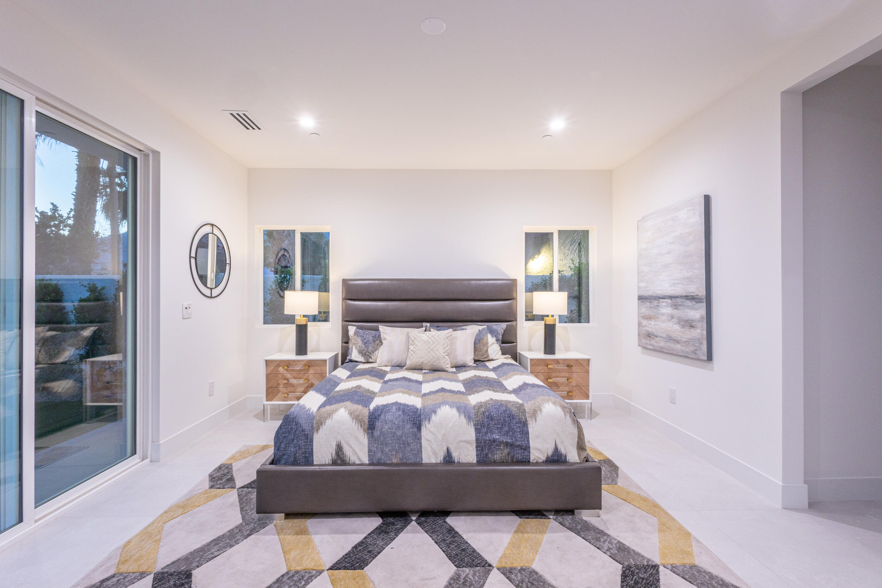 67385 Ovante Road Cathedral City, CA 92234 - Photo 13 of 32 a bed room with a bed and mirror