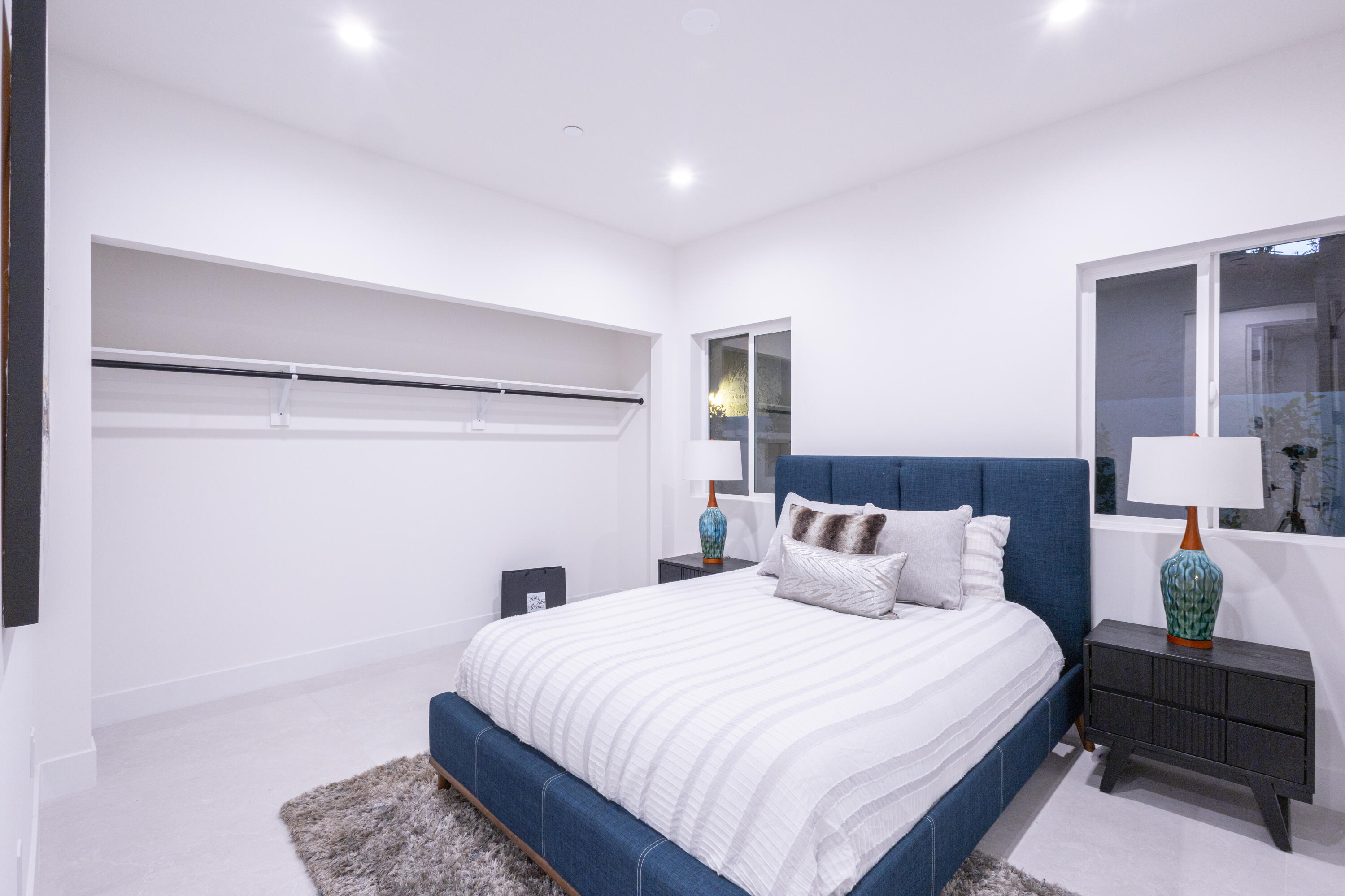 67385 Ovante Road Cathedral City, CA 92234 - Photo 15 of 32 a bedroom with a bed and wooden floor