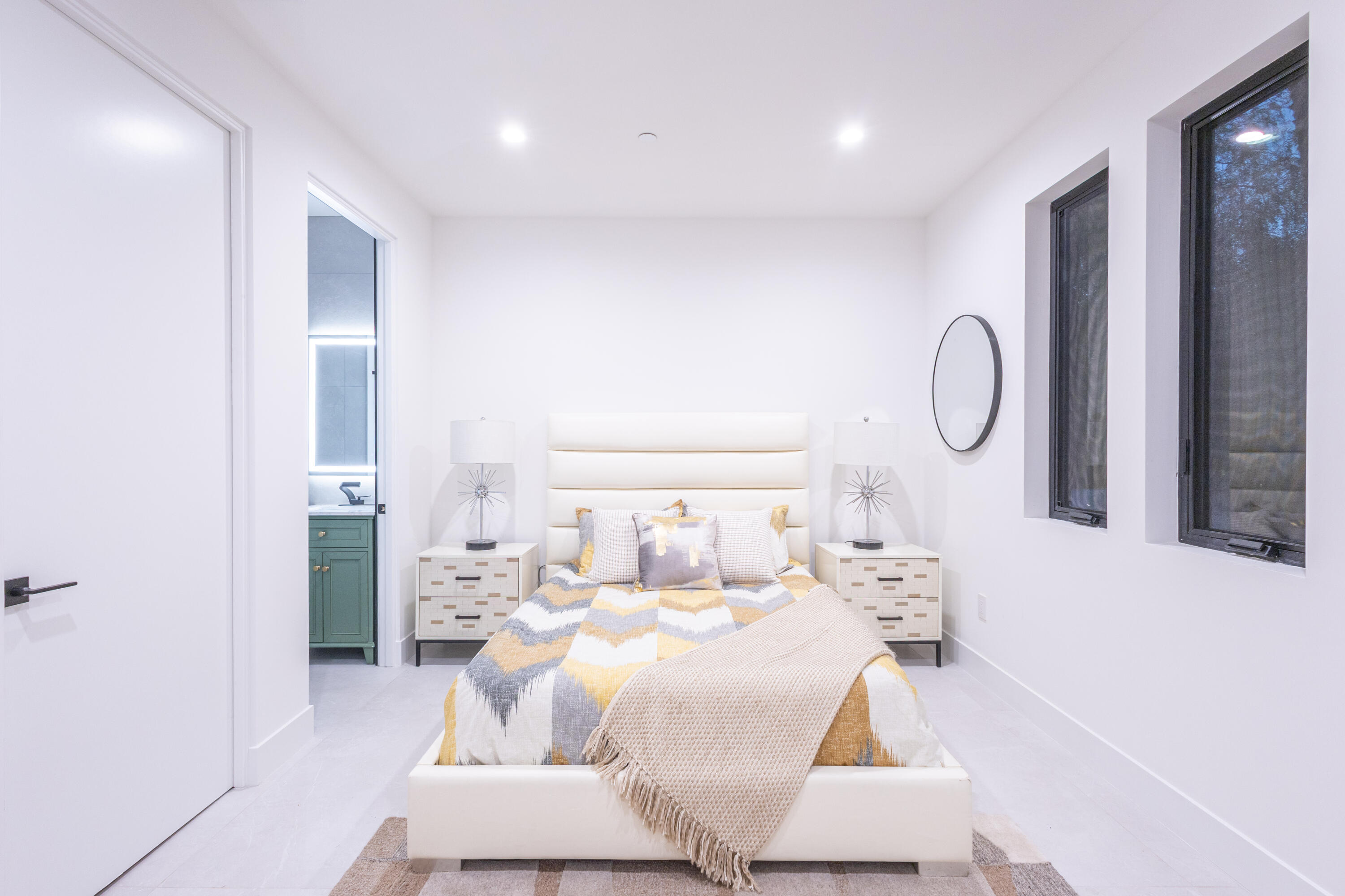 67385 Ovante Road Cathedral City, CA 92234 - Photo 17 of 32 a bedroom with a bed and a mirror