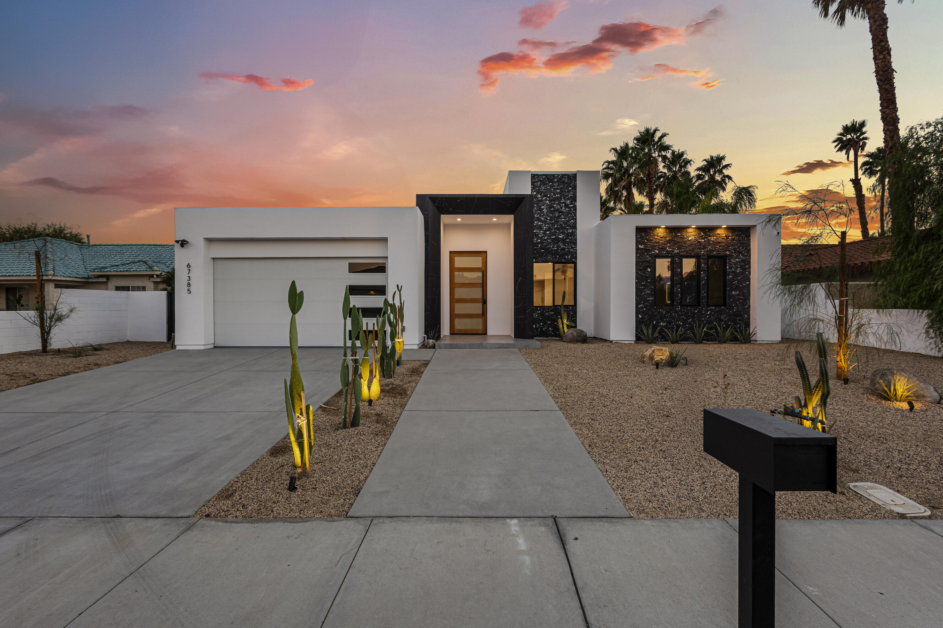 67385 Ovante Road Cathedral City, CA 92234 - Photo 2 of 32 a view of a house with couches and wooden fence