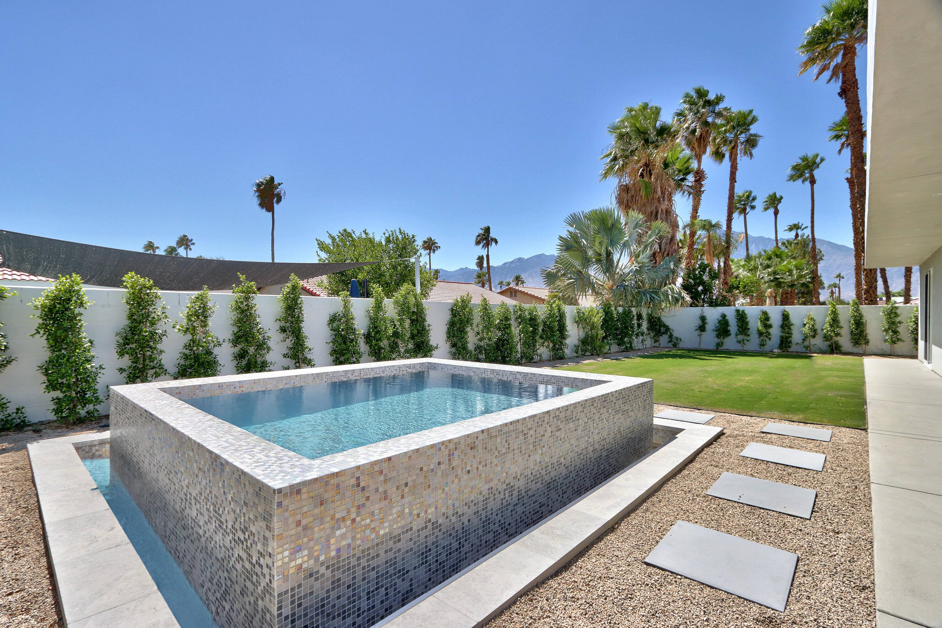 67385 Ovante Road Cathedral City, CA 92234 - Photo 22 of 32 a view of a swimming pool with a patio